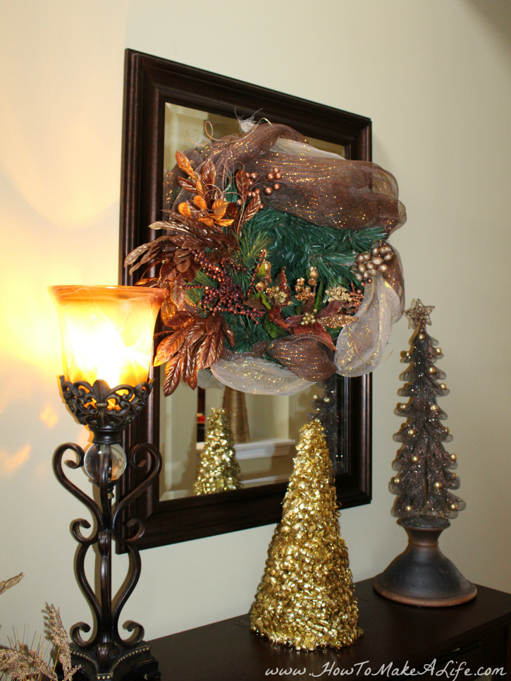 Bronze wreath and trees front hallway